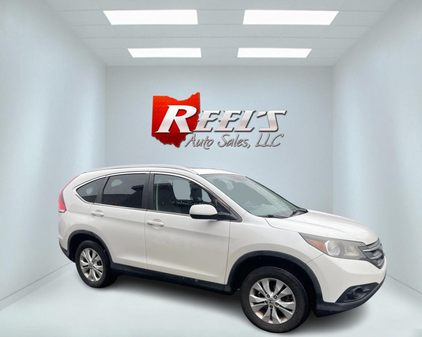 2013 White /Black Honda CR-V EX-L 4WD 5-Speed AT (5J6RM4H71DL) with an 2.4L I4 DOHC 16V engine, 5-Speed Automatic transmission, located at 11115 Chardon Rd. , Chardon, OH, 44024, (440) 214-9705, 41.580246, -81.241943 - This 2013 Honda CR-V EX-L AWD boasts a reliable 2.4L engine paired with a 5-speed automatic transmission, catering to drivers seeking both efficiency and all-wheel-drive capability. Its single-owner status may reassure potential buyers about its maintenance history. Luxurious features such as a leat - Photo#3